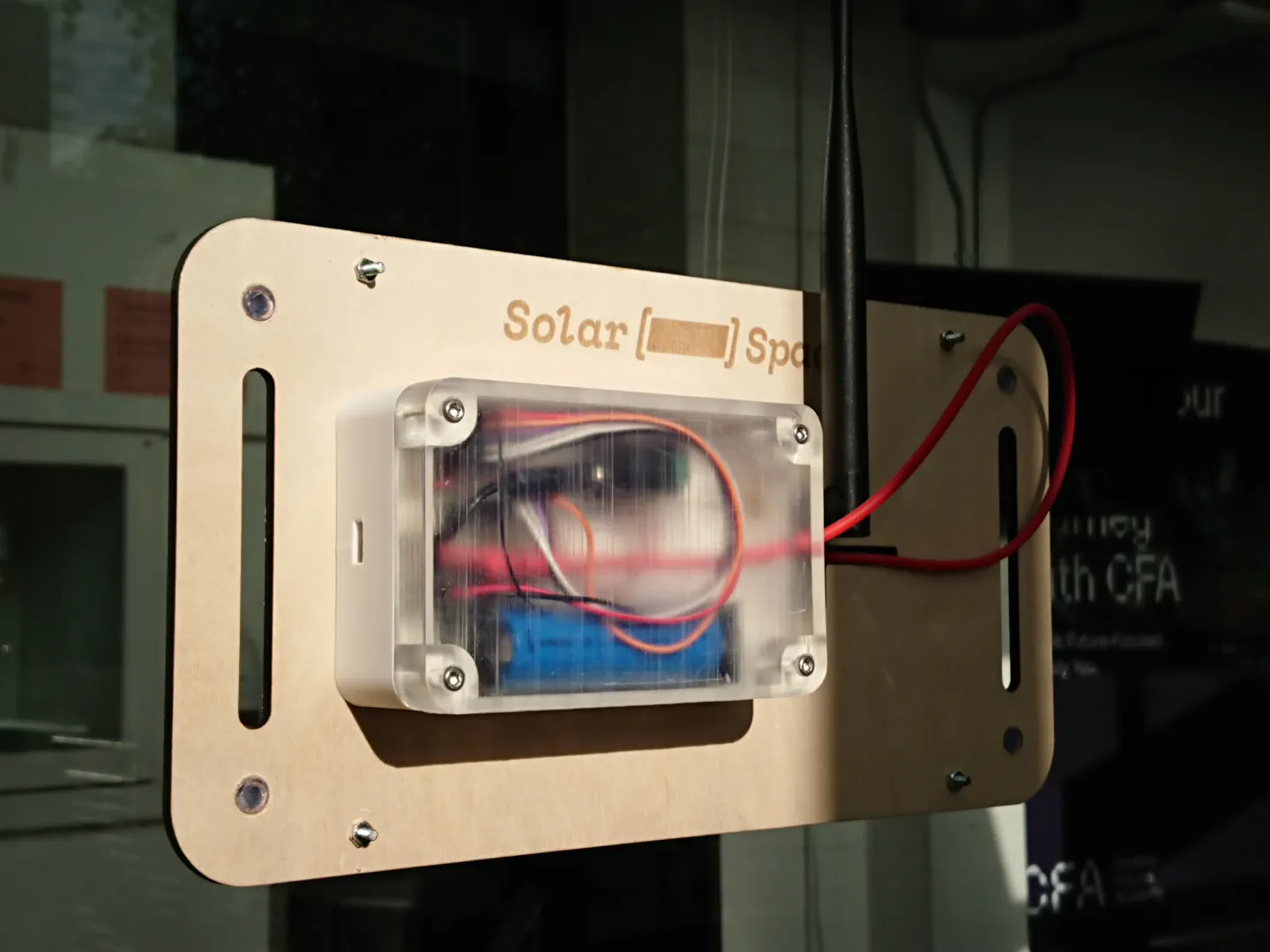 The final prototype, it sits shining in a window. The compenents are seen orderly within a 3D printed enclosure, parts are found in defined places with a sense of order overall.