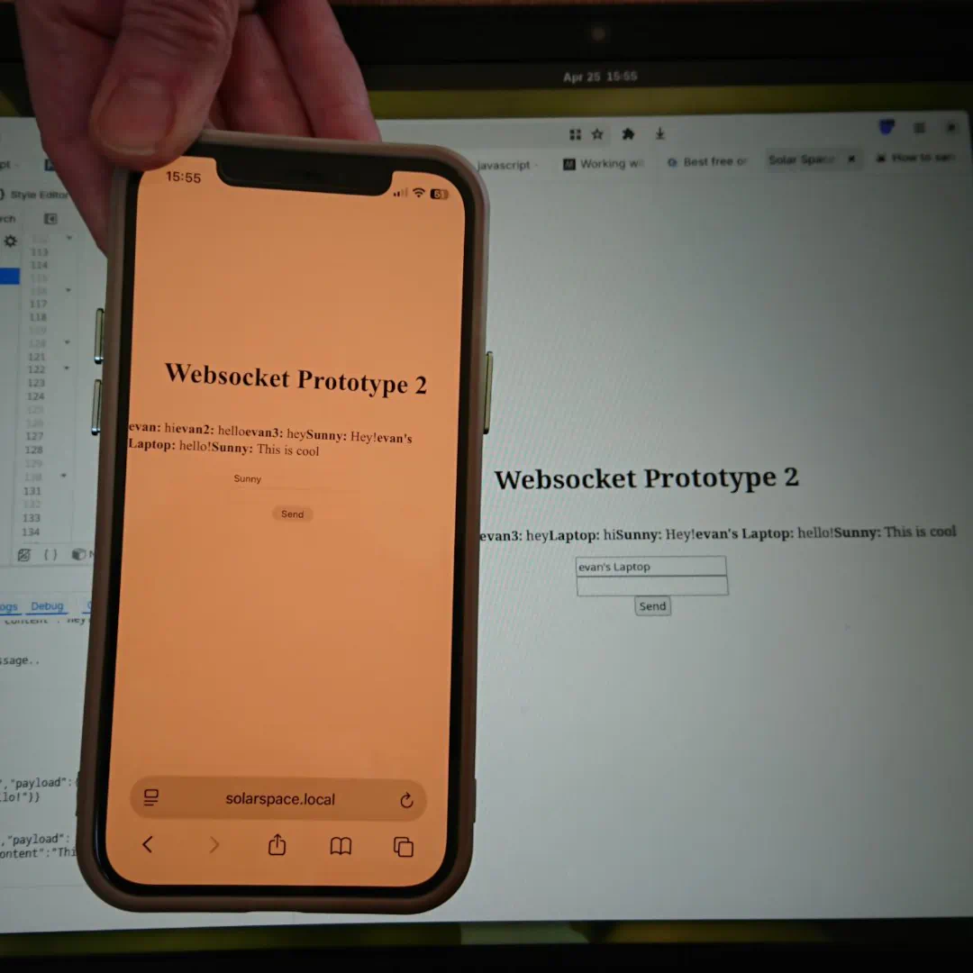 The first successful communication over solar space. A phone shows the same messages that appear on a laptop behind it.