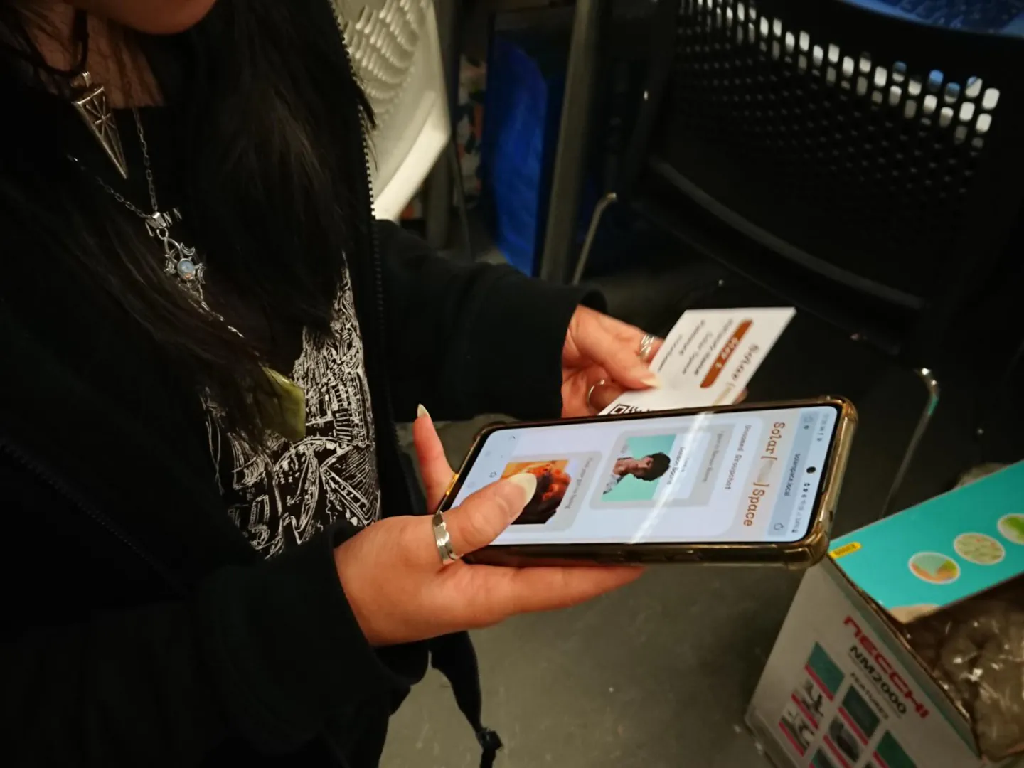 A person checks a solar space group chat to see what their friends wrote.